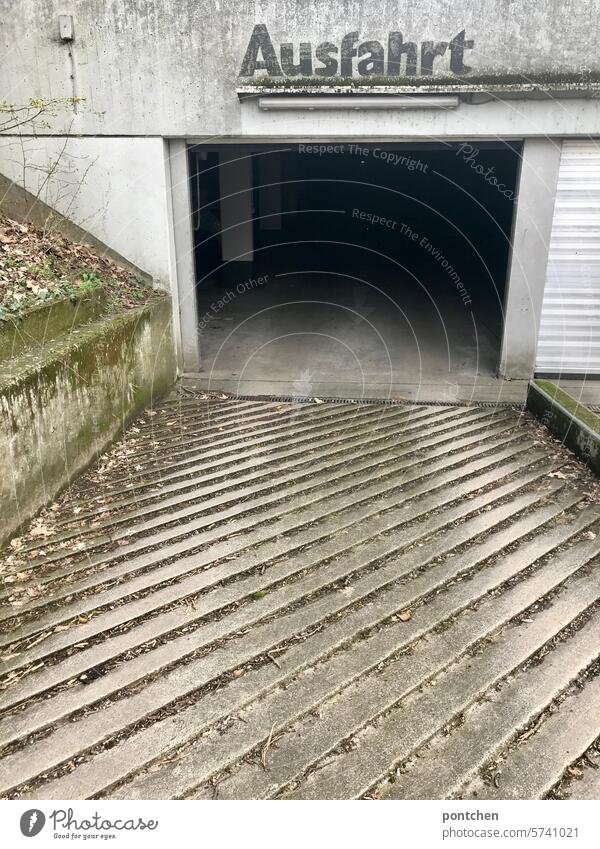 exit of an underground parking garage. tristesse Highway ramp (exit) lettering Lettering Underground garage Parking garage Parking lot Concrete Architecture