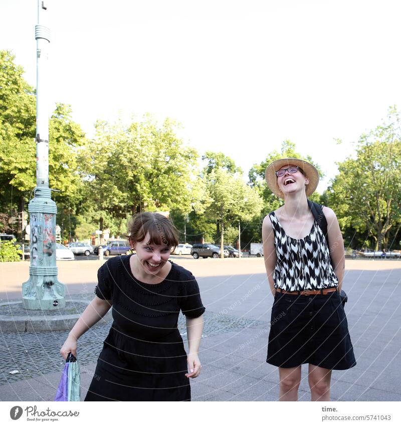 Casual on the road Woman feminine Feminine Laughter fun Berlin Column Places trees urban Town Summer Capital city Avenue Sunlight Shadow Sky In transit