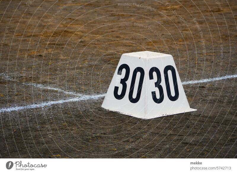 The 30th as a target number Digits and numbers Signs and labeling digit White Numbers wide Day Throw litter Sports Sporting grounds ash ash pit javelin Discus