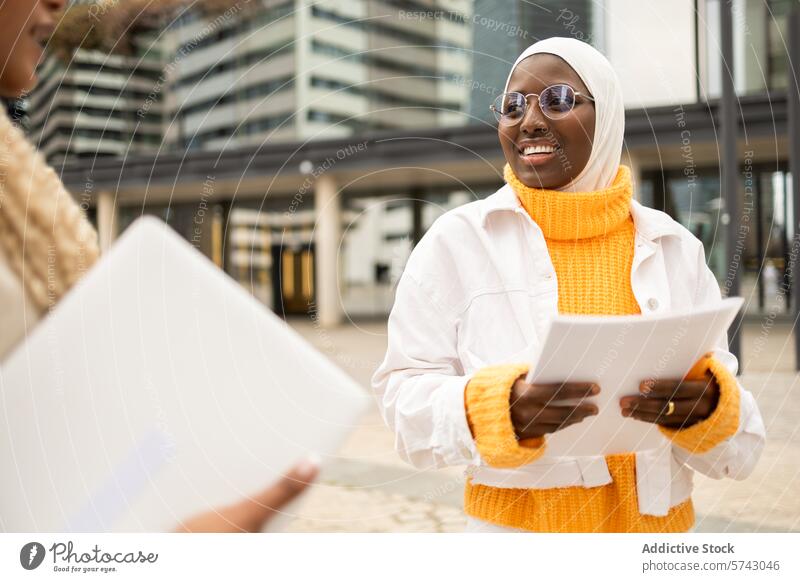 Smiling Women Conversing Outdoors in Urban Setting woman female conversation smiling city street urban outdoors friendly camaraderie friendship meeting casual