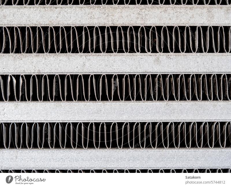 The metal grill of a car radiator is old and has scale marks texture cooling part vehicle grunge detail automotive white engine background equipment