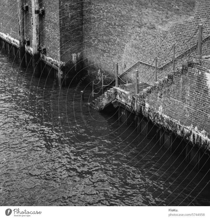 Hamburg harbor wall in black and white Harbour Water Elbe River black-and-white Port of Hamburg Navigation Port City Town Deserted Inland navigation Transport