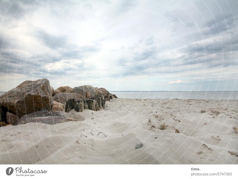 Stone groyne on the Baltic Sea Sand coast Ocean Sky vacation Weather Protection Safety Clouds Landscape Water Tourism Relaxation Nature Beach Seaweed