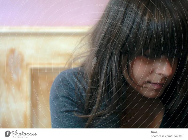 Woman in a café portrait Long-haired Dark-haired Shoulder Sweater background Wall (building) Wooden box Face Feminine Downward