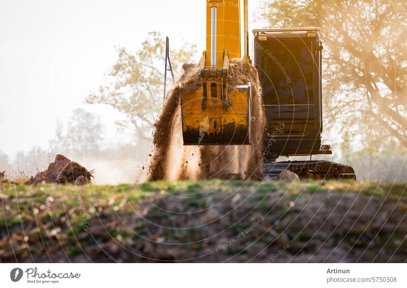 Backhoe working by digging soil at construction site.  Crawler excavator digging on demolition site. Excavating machine. Earth moving machine. Excavation vehicle. Construction business.