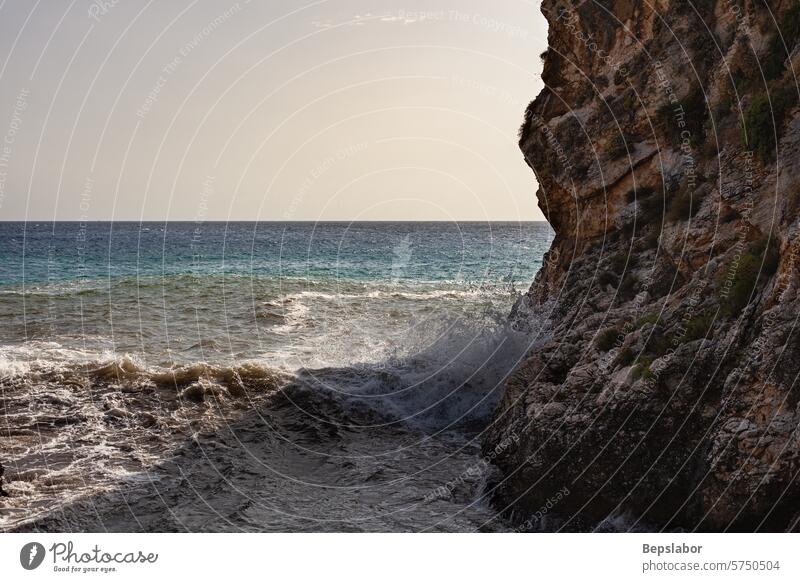 Large waves breaking over rocks seascape mediterranean bay cliff italy island nature water tour tourism horizontal italian no people photography reef scenery