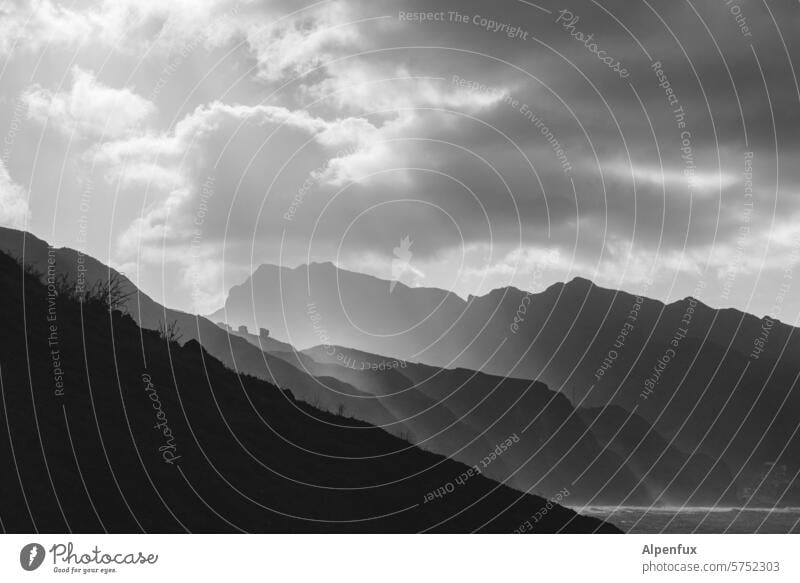 Hike in the gray area Hill Sunlight Landscape Sky Mountain mountains Clouds Rock Peak Exterior shot Nature Deserted Ocean Atlantic Ocean coast Vacation & Travel