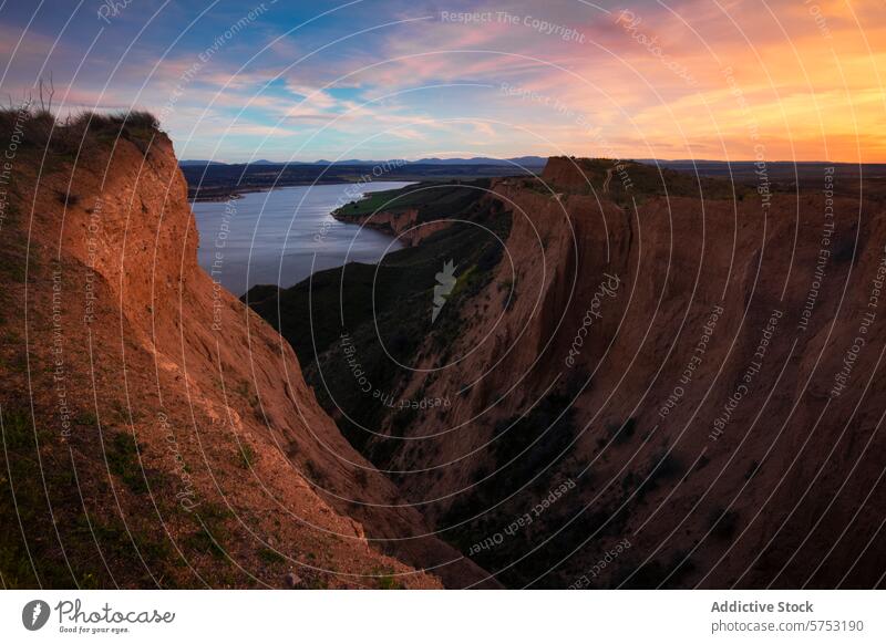 Sunset hues over the Badland cliffs in Burujon, Toledo landscape sunset badland burujon toledo river sky reflection dusk glow serene tranquil picturesque scenic