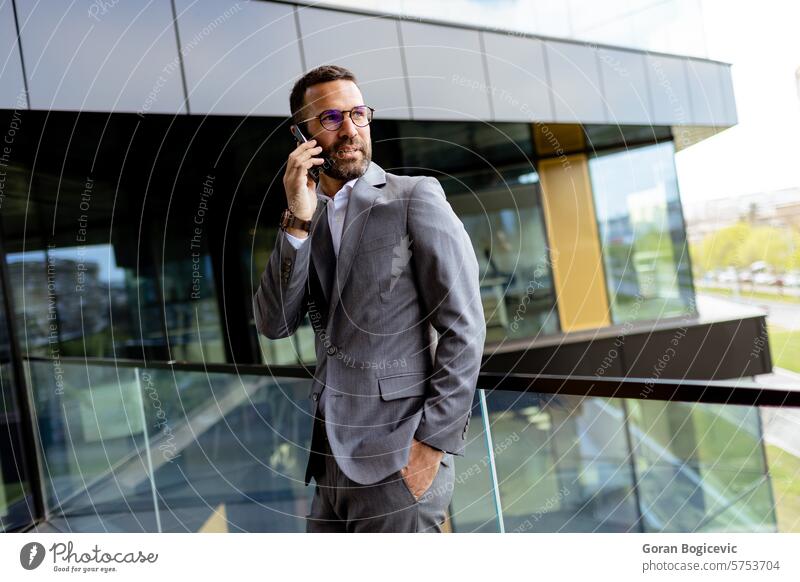 Confident Businessman Smiling in Sharp Suit Against Modern Glass Office Facade. Generative AI ambition architecture building business businessman career city