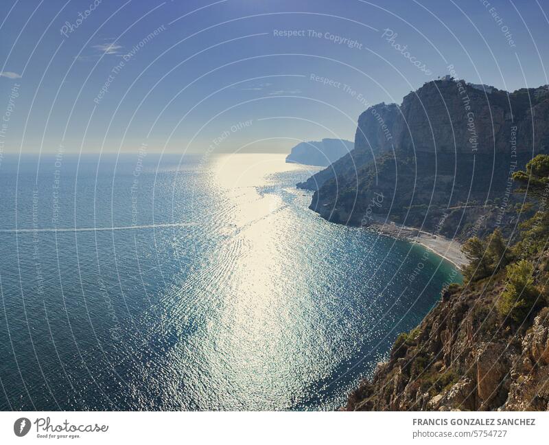 Landscape on the coast of Benitachell, province of Alicante in Spain. benitachell Europe Horizontal recording Spanish Ocean Water Sky Rock vegetation Winter