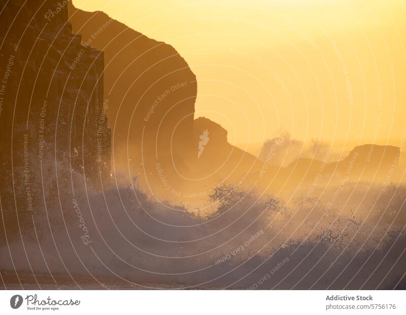 Golden hour waves breaking on the rugged coastline of Iceland iceland sunset sea spray cliff golden hour landscape travel destination nature water ocean scenery