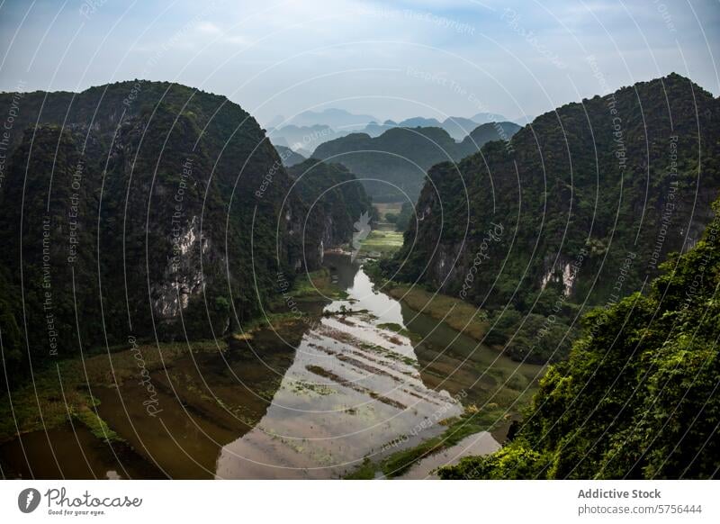 Scenic Karst peaks and river landscape in Vietnam vietnam karst mountains water scenery tranquil nature dense towering natural grandeur lush greenery vegetation