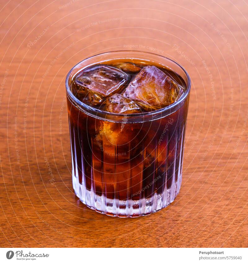 Cold brew coffee on the wooden table. fresh brown morning sweet beverage drink glass breakfast caffeine background food natural white space closeup liquid cup