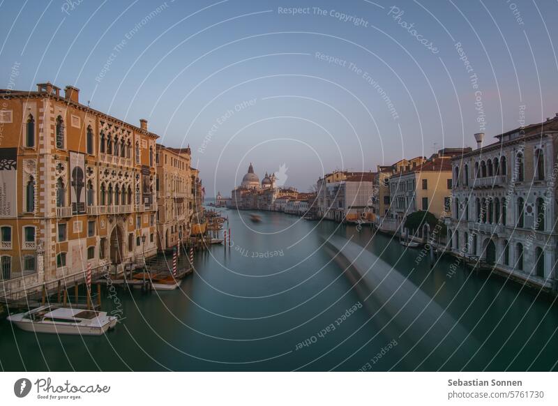 Long Exposure view of Grand Canal and Basilica Santa Maria della Salute seen from the Rialto Bridge on a hazy winter evening, Venice, Veneto, Italy italy europe