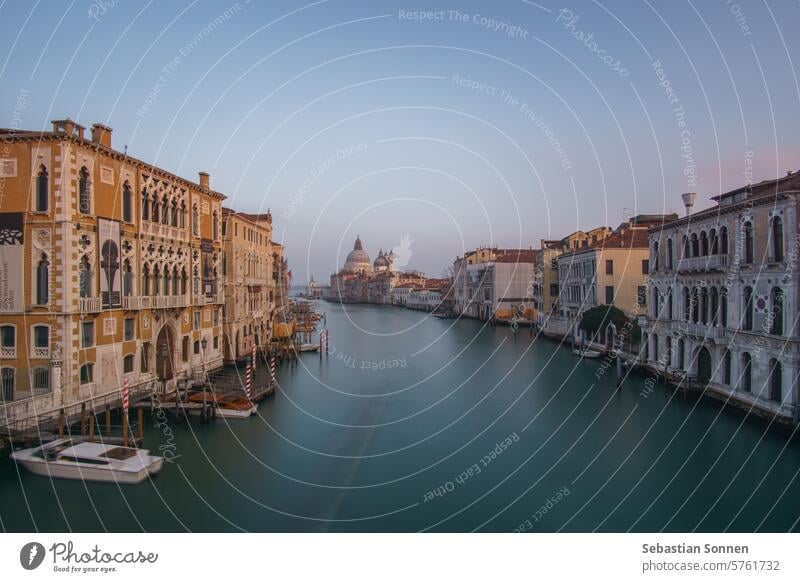 Long Exposure view of Grand Canal and Basilica Santa Maria della Salute seen from the Rialto Bridge on a hazy winter evening, Venice, Veneto, Italy italy europe