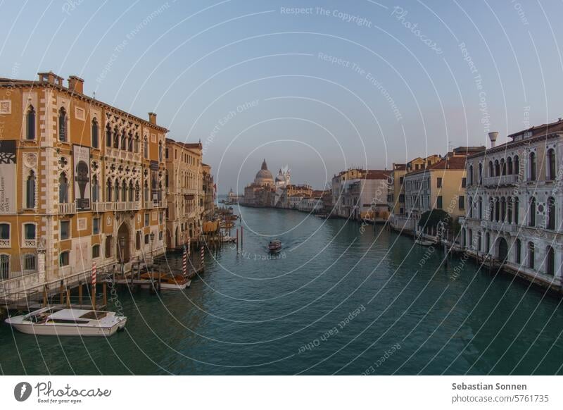 View of Grand Canal and Basilica Santa Maria della Salute seen from the Rialto Bridge on a hazy winter evening, Venice, Veneto, Italy italy europe travel venice