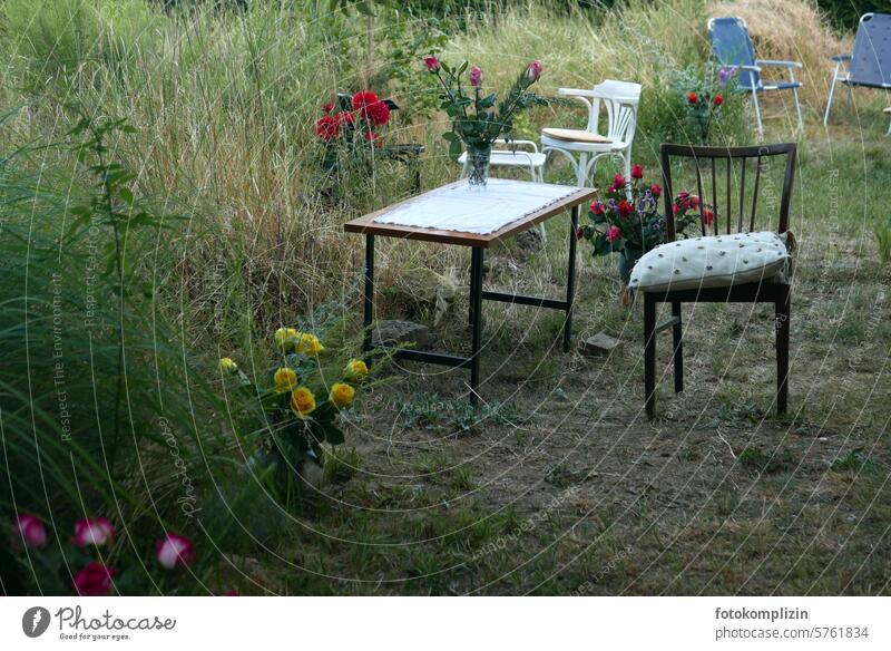 Roses, table and chairs in an overgrown garden garden party Garden Transience Social life celebration roses Deserted Seating Firm forsake sb./sth. togetherness