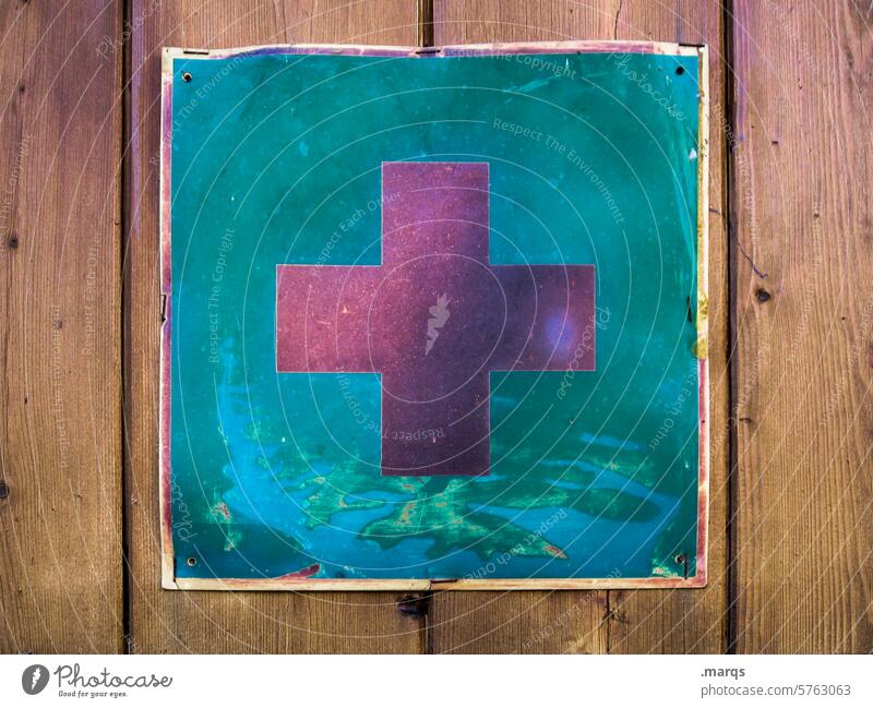 In an emergency Symbols and metaphors Signs and labeling Help Red Cross Healthy Emergency doctor First Aid Rescue SOS Turquoise Wooden wall Close-up