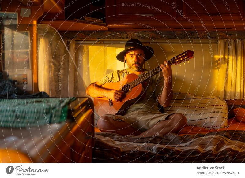 Nomadic Musician Composing in Motorhome at Sunset musician man classical guitar motorhome sunset inspiration sea nomadic lifestyle composing travel creativity