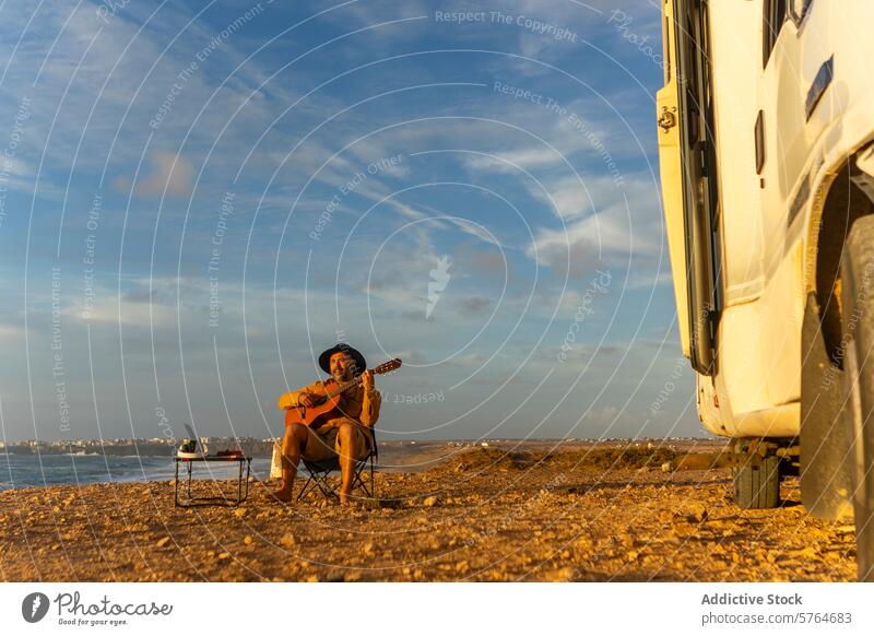 Nomadic Musician Composing by the Sea at Sunset musician guitar man motorhome sunset sea inspiration nomadic composing seaside travel lifestyle van life coast