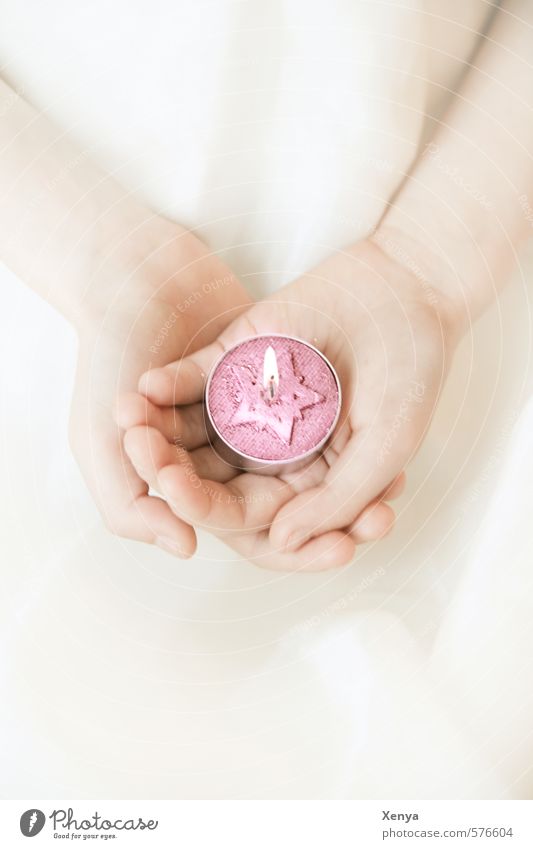 Light in your hand Child Girl Hand 1 Human being 3 - 8 years Infancy Dress Touch Illuminate Warmth Pink White Romance Peaceful Hope Christmas & Advent Candle