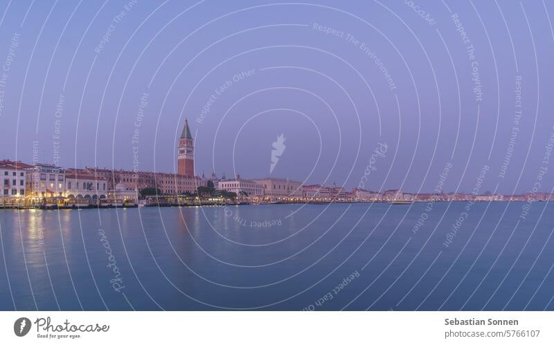 Panoramic view from sea of Piazza San Marco Campanile and Doge Palace during blue hour, Venice, Veneto, Italy venice cityscape italy travel architecture town