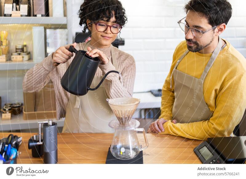 Multiethnic baristas preparing pour-over coffee in a cozy cafe teamwork café brewing multiethnic skill inviting warm preparation together drink beverage craft