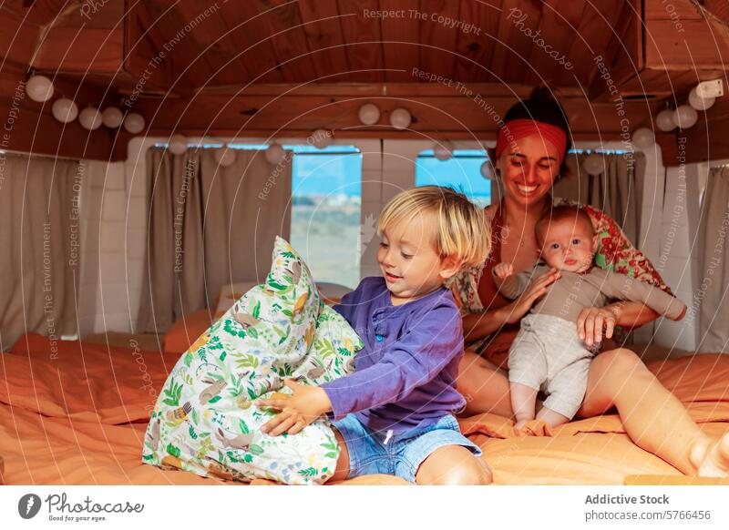 Family enjoying their van life with handmade amenities family woman baby boy children homemade deck facilities van interior coziness alternative lifestyle