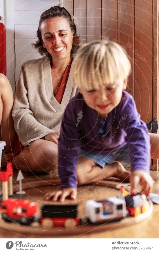 Van life family with homemade deck and van life home deck lifestyle travel mobile home happiness joy woman child baby boy playing toy train smile bonding