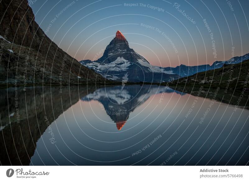 Alpenglow on Matterhorn Reflected in Riffelsee Lake at Dusk alpenglow matterhorn reflection riffelsee lake dusk zermatt switzerland tranquil mirror peak