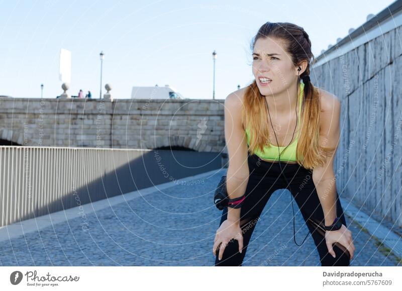 fit happy woman resting after do sport , running and workout fitness stretching exercise young training healthy listening music outdoor beautiful lifestyle park