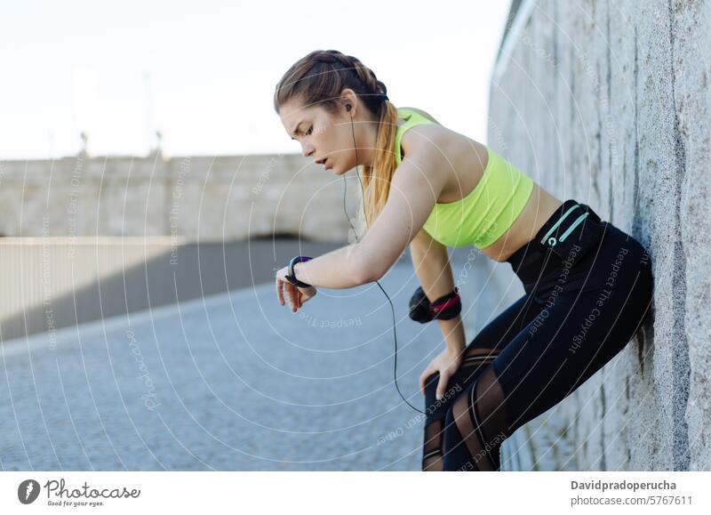 fit happy woman resting after do sport , running and workout fitness stretching exercise young training healthy listening music outdoor beautiful lifestyle park