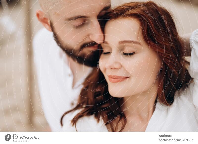 pregnant girl and boyfriend on a picnic wife white clothes coast seas nearby clay steep cliff mountain water walk sunset light warm summer forever bride