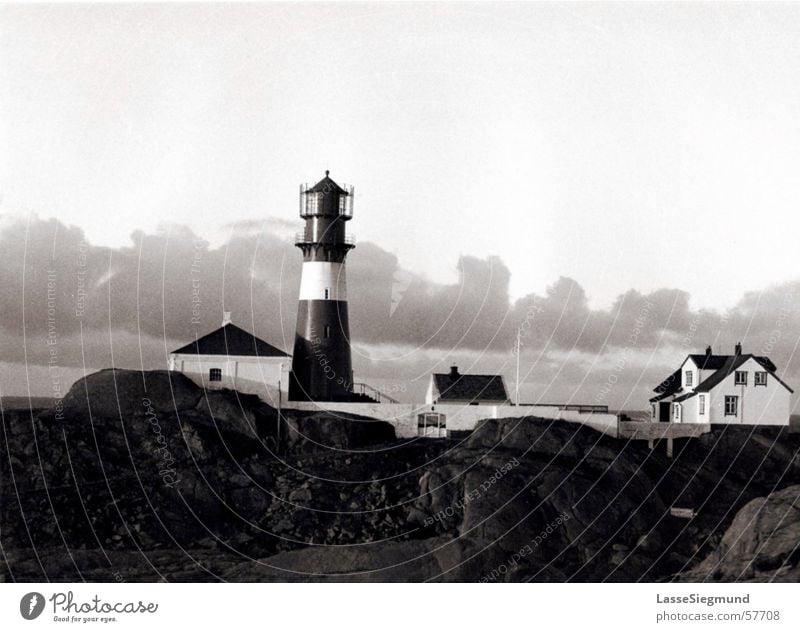 lighthouse Lighthouse Norway Black White House (Residential Structure) Lighthouse operator Clouds Historic Beach Coast Island Black & white photo Rock Sky