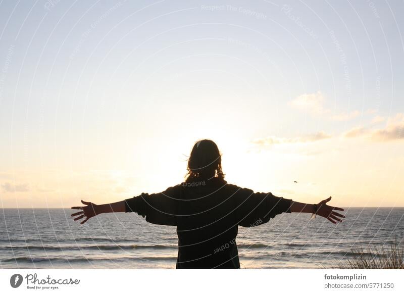 young woman embraces the sea with horizon Ocean Horizon Sunset Beach Sky Water Woman Young woman Girl person Human being Relaxation Vacation & Travel Longing