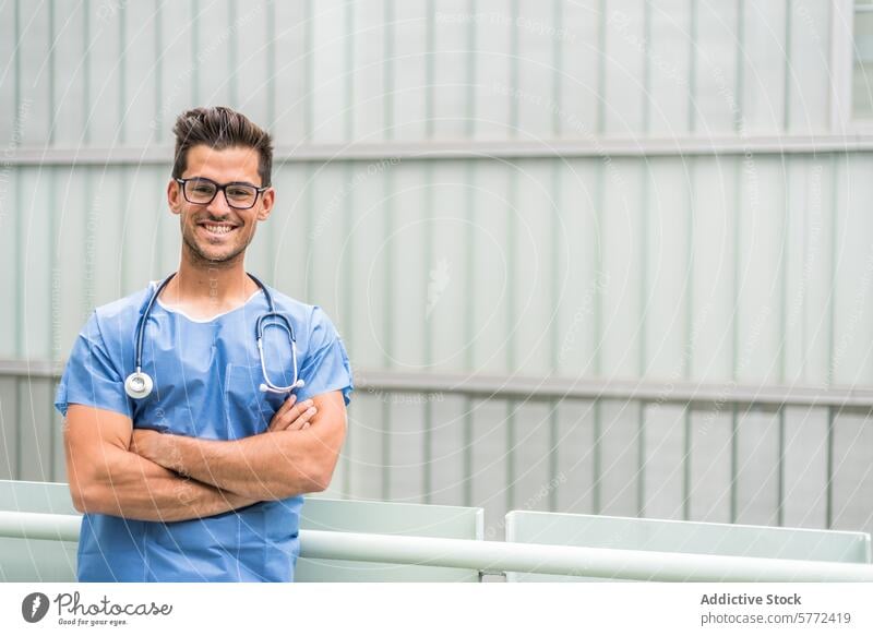 Doctor with crossed arms posing assistance browsing care cell cellphone clinic communication copy space device doctor gadget glasses health healthcare