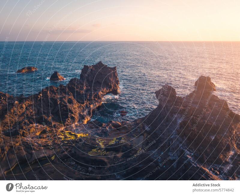 Rugged coastal landscape of La Palma at sunset la palma spain volcanic rock formation island sea ocean nature beauty warm glow rugged rocky scenery outdoor