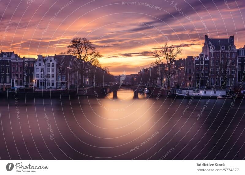 Serene twilight over Amsterdam canals amsterdam netherlands evening peaceful cityscape historic charm skyline dusk serene water reflection architecture dutch