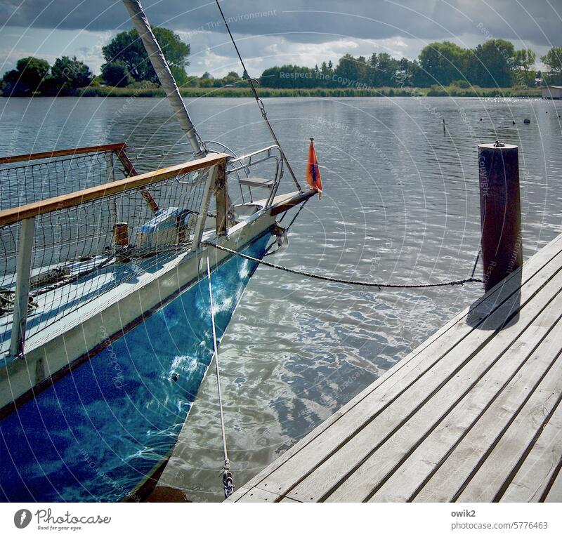 bow Hull Sailboat Water Navigation Bow Idyll Reflection Peaceful Yacht Boating trip Exterior shot Colour photo Maritime Watercraft Jetty Berth fix