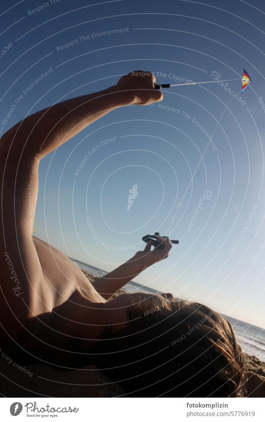 Boy with kite in the sky Child Boy (child) kites kites rise Tall Playing beach day climb the kite Kite Wind Dragon Joy Leisure and hobbies Flying fly a kite