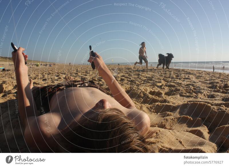 Children playing on the sandy beach Boy (child) children Sandy beach Beach climb the kite Romp Dog holidays vacation chill Playing Relaxation Vacation & Travel