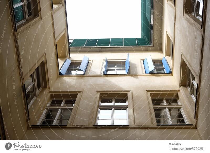 Beautiful old building in khaki and natural colors with shutters in blue in a narrow backyard in the old town of Prague in the Czech Republic Nude construction