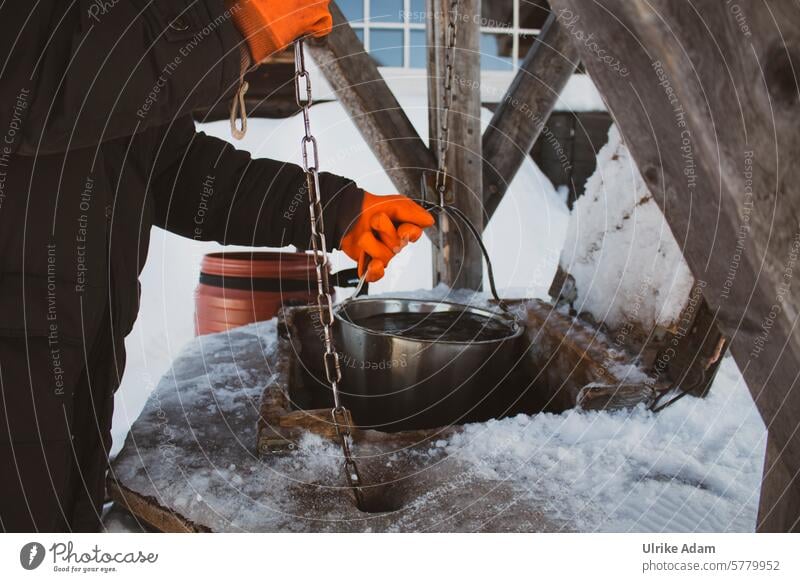 Lapland | At the fountain Arctic circle Adventure Snowscape Man Bucket scoop Well Ice Swede Europe Winter vacation Nature Exterior shot Cold Vacation & Travel