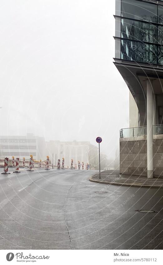 Street corner Town Architecture Construction site Fog Building Sky Asphalt Facade Modern Manmade structures Downtown autumn mood autumn fog Shroud of fog Gray