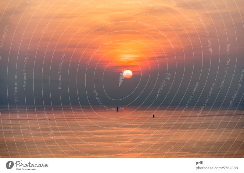 Moneglia in Italy liguria italy ligurian riviera riviera de levante ligurian sea mediterranean coast hill evening sunset sundown dusk dawn sunlight sailing boat