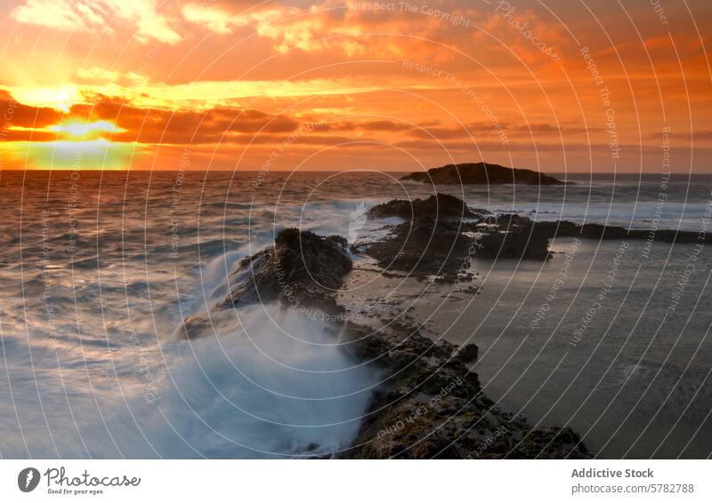 Sunset and waves on a rocky coastline sunset sea ocean skyline vibrant majestic evening dusk natural beauty landscape seascape outdoor nature cloud golden hour