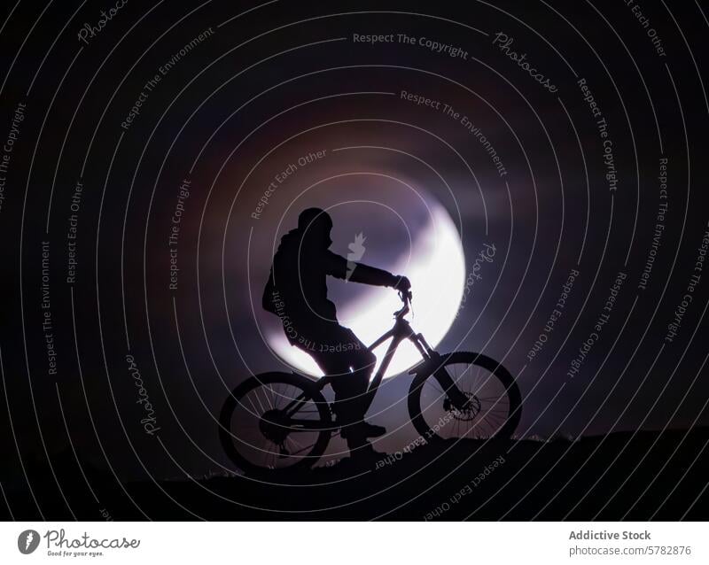 Summer night cycling with full moon silhouette cyclist mountain bike adventure summer ride bicycle sky outdoor activity leisure sport biking moonlight evening