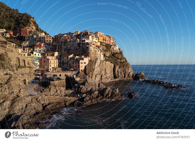 Coastal village of Cinque Terre in Italy at sunset italy cinque terre coastline colorful houses architecture sea mediterranean travel tourism cliff