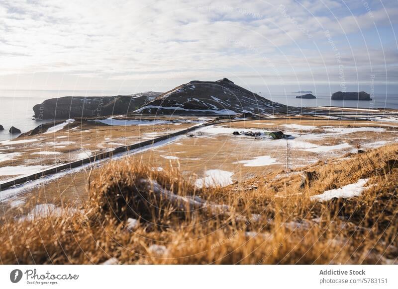 Tranquil winter landscape of coastal Iceland iceland tranquil coastline snow countryside sky ocean horizon nature scenery serene cold outdoor arctic nordic