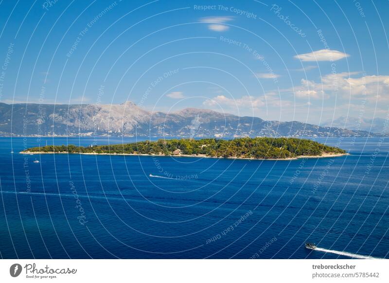 The small island of Lazareto in the picturesque bay in front of Corfu town travel tourism landscape corfu summer sea water nature sky clouds seascape light sun